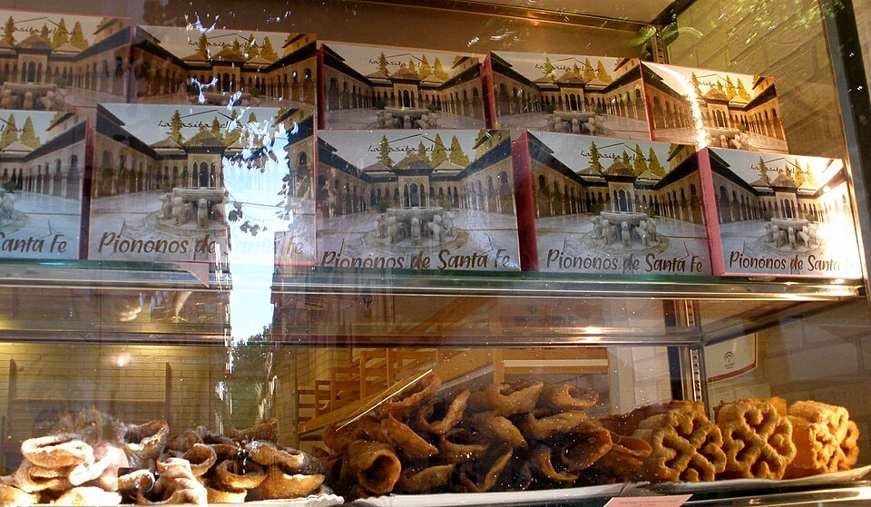 Piononos from Santa Fe, out on the vega — a mouthful of soaked sponge and cream, eaten in one.